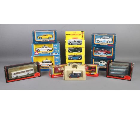 A collection of boxed scale model vehicles, to include examples from Matchbox, Burago and Exclusive First Editions.  