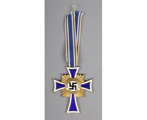 German WW2 Cross Of Honour Of The German Mother Gold with ribbon. This award was instituted on 16 December 1938. The idea was