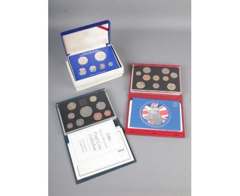 Three cased proof coin collections including 1996 Twenty Five Years of Decimal Coinage, 2004 Celebrating Human Achievement an