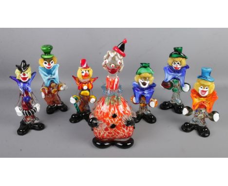 A collection of seven Murano style glass clowns including large decanter example. Repairs to bow of one clown and hat of deca