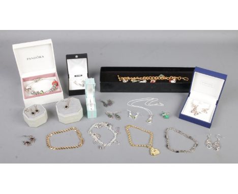 A large quantity of silver and silver mounted jewellery. To include Franklin Mint Christmas themed charm bracelet, butterfly 