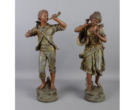 After Auguste Moreau, a pair of spelter figures; a boy playing the horn and a girl with flower basket holding her ear. Both s