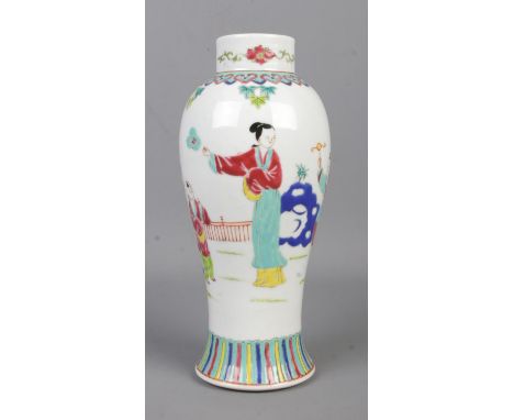 A mid Twentieth Century Chinese Famille Rose vase, depicting children playing. Bearing character marks to the base. 23cm tall