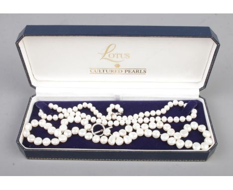 Two strings of cultivated pearls one having silver clasp.  