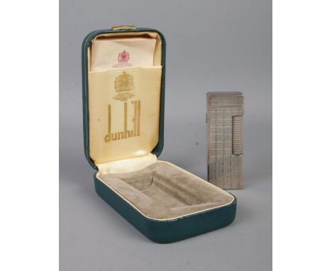 A vintage Dunhill Rollagas lighter, in box with directions leaflet. With chequered pattern, stamped to the base.  