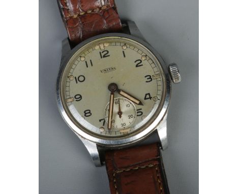 A Unitas ATP Army Trade Pattern WW2 men's manual wristwatch featuring subsidiary running second dial and leather strap. Seria