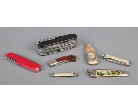 Seven folding knives, including Richards of Sheffield, Grants Whisky and multi-tool examples. CANNOT POST OVERSEAS.  