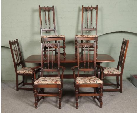 An Ercol 'Old Colonial' refectory table and set of six chairs including two carver examples. Approx. dimensions of table 176c
