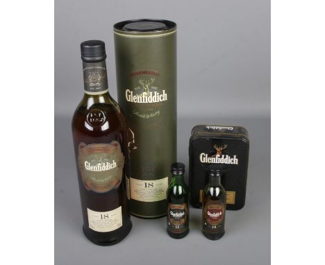 A collection of Glenfiddich Single Malt Scotch Whisky to include Ancient Reserve 70cl bottle in original card box and miniatu