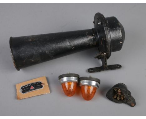 A 1927 A. Rist horn, two amber indicators and one light fitting originally for an Austin 7.  Name plate for horn is present b