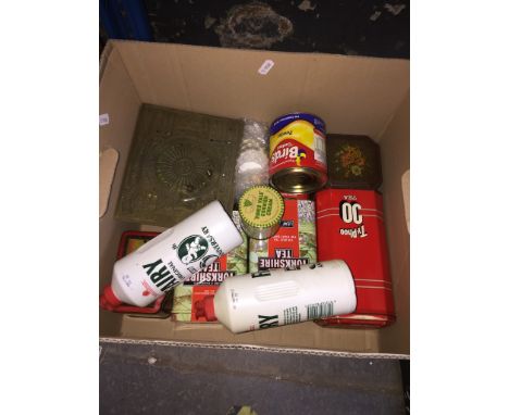 Collection of vintage tins and containers and a sundial 