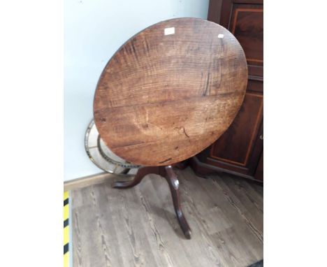 A Georgian oak tripod table. 