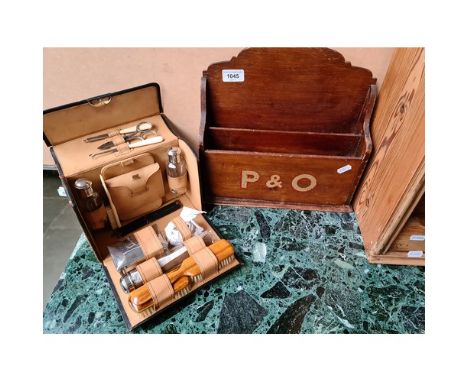 A wooden letter tidy marked P &amp; O and a vintage grooming kit marked E.C.C.W 