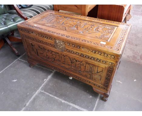 An eastern carve camphor wood chest. The dimensions of this item is Height:23inches/ Width:20.5 inches/ Length:40cm.
