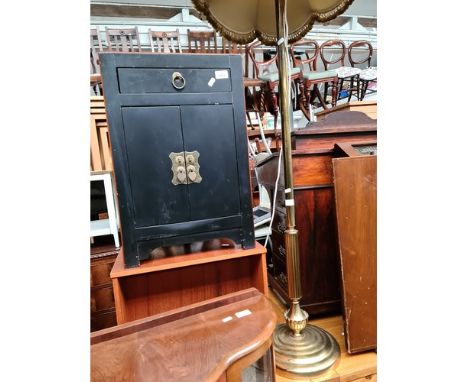 A small oriental style cabinet and a brass standard lamp 