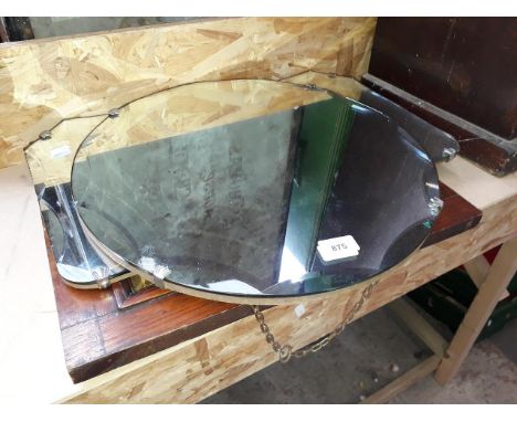 Two bevelled mirrors and a wooden framed mirror. 