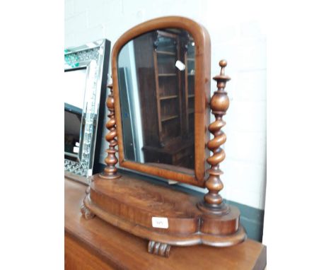 A victorian mahogany toilet mirror with twist pillars. 