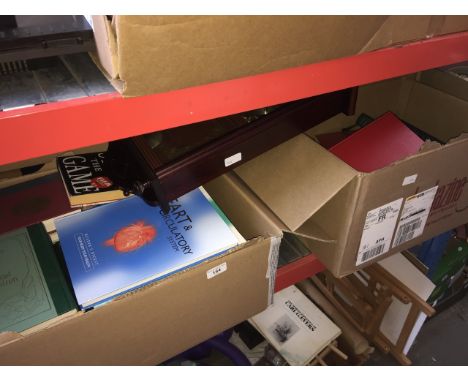 6 boxes of books and a wall clock. 