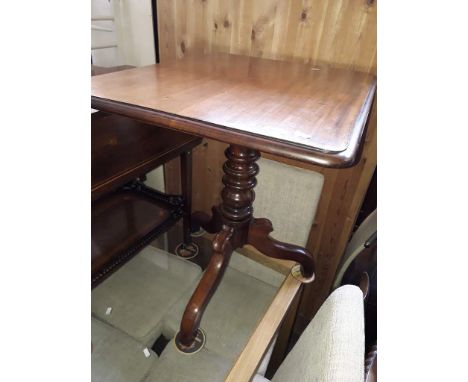 A Victorian tripod table. 