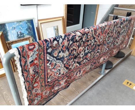 An Eastern carpet 128cm x 202cm. 