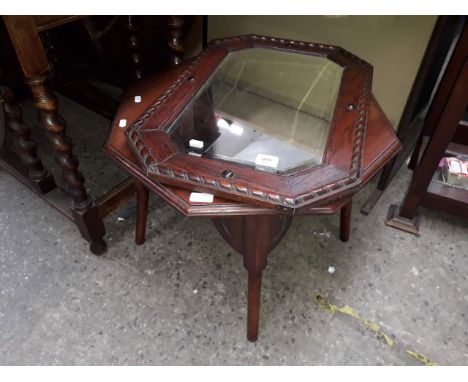 An oak framed mirror, a large mirror and an occasional table. 