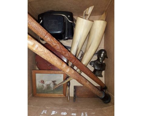 A mixed lot comprising two carved walking sticks, a Pentacon camera, a tape measure, a miniautre portrait of a dog, cow horns