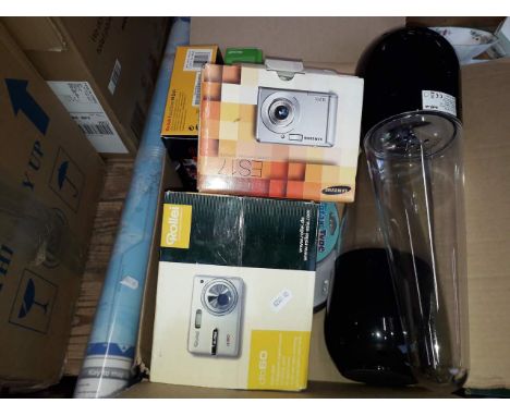 A box containing camera accessories including a Rollei db60 digital camera, a pair of blue tooth speakers, world map etc. tog