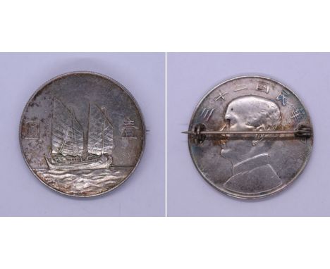 Silver Chinese coin set as brooch 