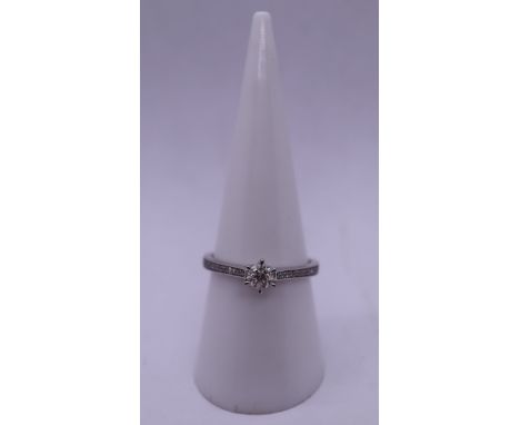 9ct white gold diamond solitaire ring - Size O 