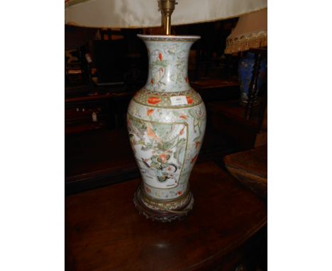A 20th C Chinese famille rose table lamp decorated with warriors and butterflies