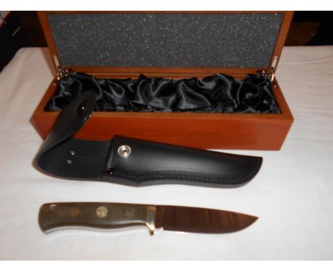 A new Jarl Fallkniven F1 3G green Micarta hunting knife with leather sheath housed in a wooden presentation box