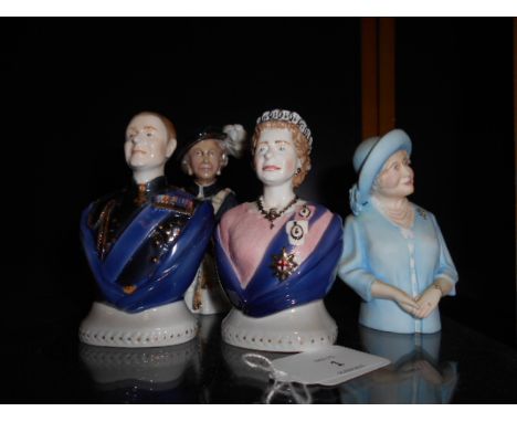 A group of four Royal Worcester candle snuffers in the form of members of the Royal family