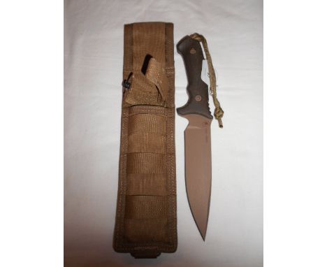 A boxed new American 'Sparton Blades' hunting knife with canvas sheath together with a Spartan honor coin