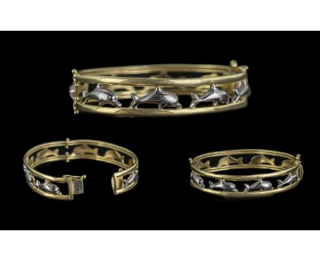 14ct Gold - Pleasing Two Tone Dolphins Design Hinged Bangle. Marked 14ct. Set with Figural Image of Dolphins to All Sides of 