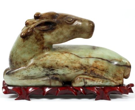 ARCHAIC JADE CARVED HORSE, H 10", L 17":  Green  to russet brown in color on a fitted wooden  stand. Carved from a single pie