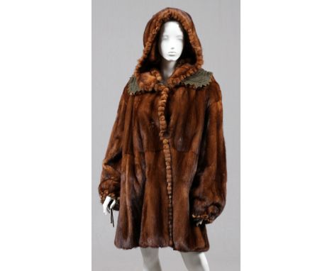 FENDI BROWN MINK REVERSIBLE COAT WITH HOOD, SIZE  42:  Light brown mink with pom trim, two large  Fendi buttons flanked by sl