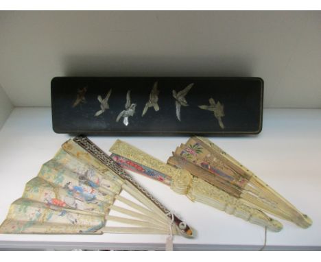 Three fans and a Japanese inlaid black lacquer box, the paper leaf of one bone sticked fan painted with a hunting scenes, ano