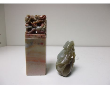 A jade gourd pendant together with a soapstone seal, the former carved as a forked tail squirrel on a double gourd, 5cm (2 in
