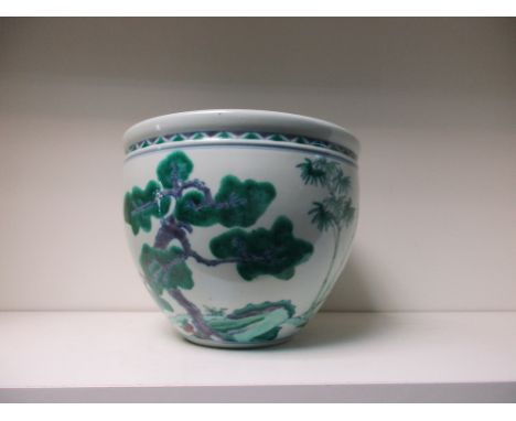 A wucai planter, the rounded sides of the exterior painted with pine, bamboo and flowering cherry below and chevron rim band,