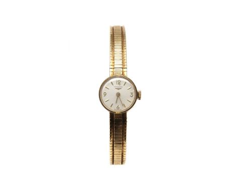 A ladies' 9ct gold Longines mechanical bracelet watch, a silvered dial with baton hour markers and Arabic numerals at the qua