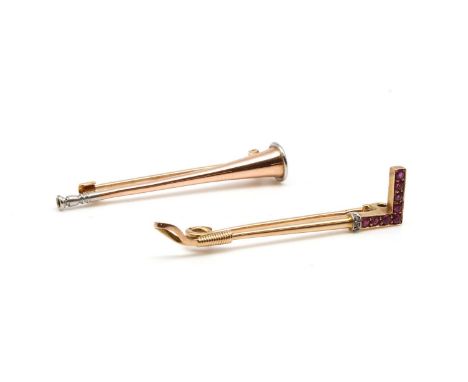 A Continental gold ruby and diamond set riding crop bar brooch, or stock pin, with Swiss cut rubies grain set to the handle, 