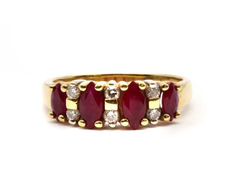 A gold ruby and diamond ring, with four graduated marquise cut rubies, with pairs of brilliant cut diamonds between, all claw