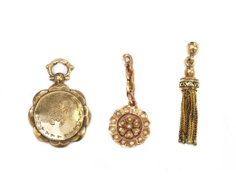A Continental gold tassel, with black enamel to the cap, some losses, marked 585, 37mm long,together with a Continental gold 