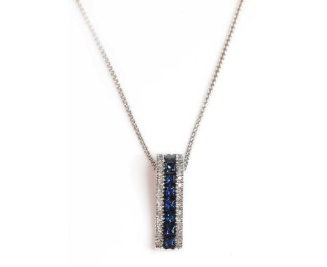 A white gold sapphire and diamond arched bar pendant,with a central row of princess cut sapphires. Two outer rows of eight cu