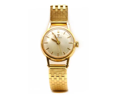 A ladies' gold Tissot mechanical bracelet watch, 20.5mm diameter with a silvered dial and baton hour markers, to later brick 