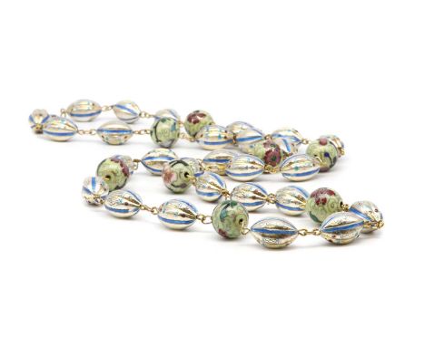 A silver enamel bead necklace,with oval silver fluted beads with blue enamel decoration, with later metal enamel beads betwee