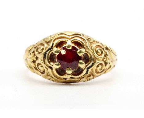 A gold single stone ruby ring, with a circular mixed cut ruby, approximately 4.65mm diameter, claw set to tapered scroll shou