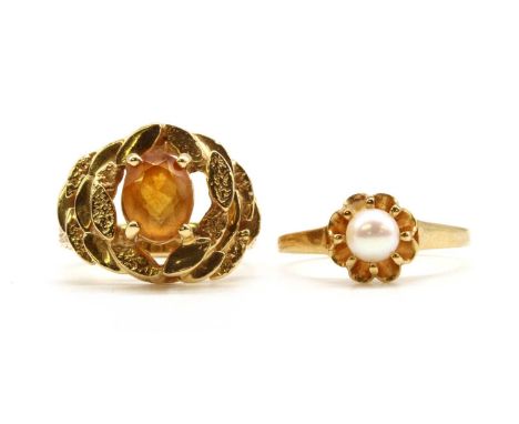 Two gold rings, to include a gold single stone citrine ring, with an oval mixed cut citrine, claw set, to stepped surround an