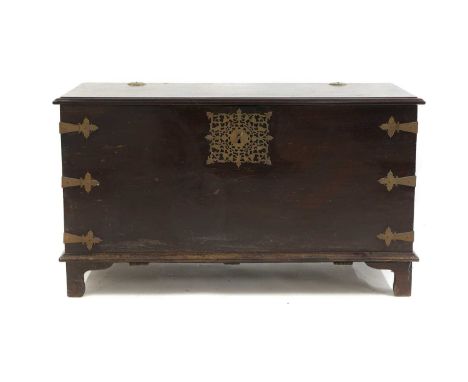 An Indo-Portuguese-style teak chest 20th century, brass mounted with pierced detail and carry handles,128cm wide62cm deep72cm