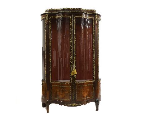 A Louis XV style king wood and marquetry display cabinet, 19/20th century, the serpentine shaped front with a single door, or